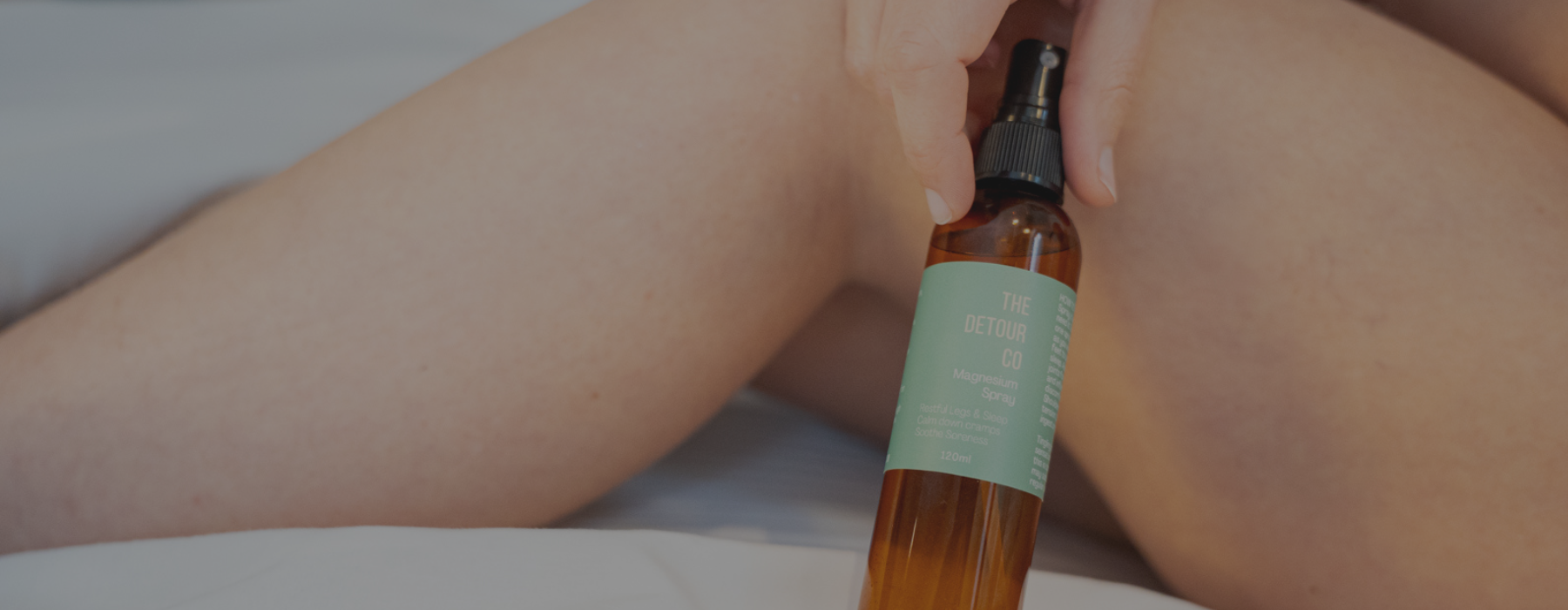 Topical magnesium spray crafted to support relaxation and daily wellness routines in amber bottle.